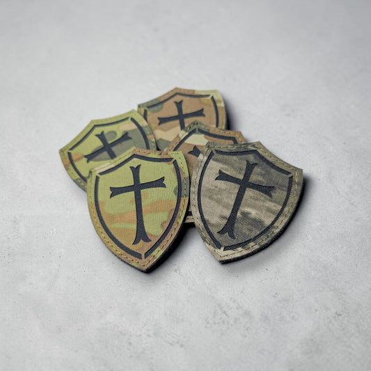 Crusader cross Camouflage shield patches with crosses on a gray surface